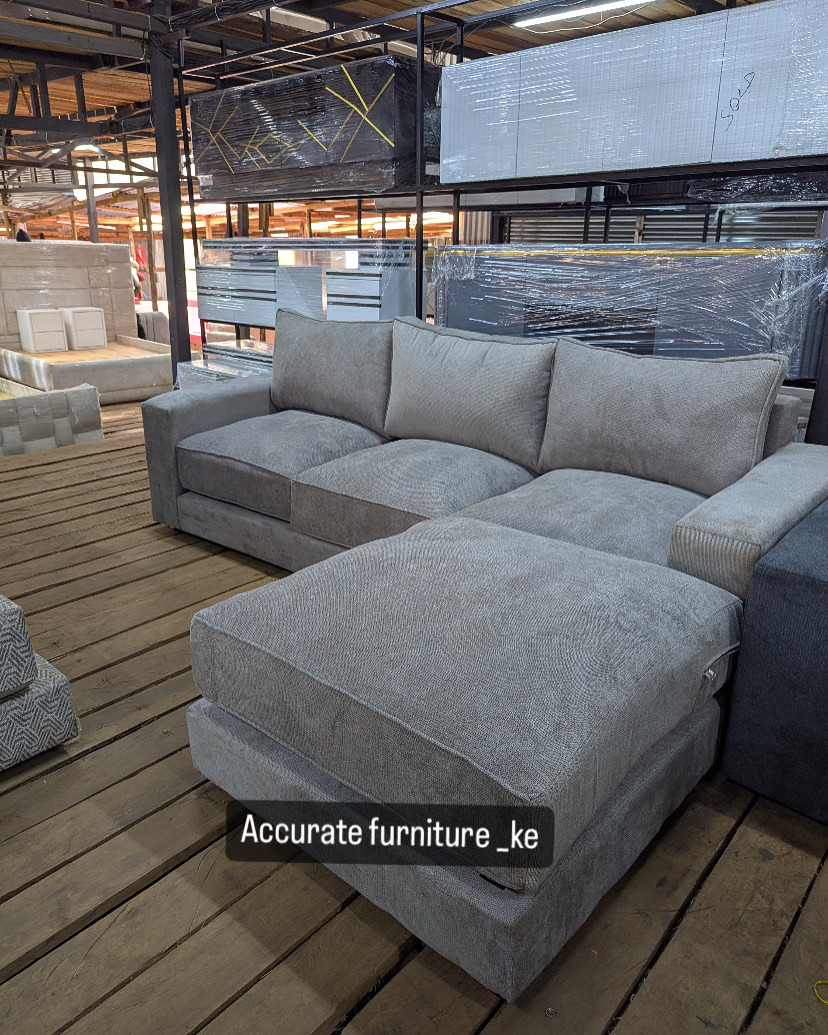 Three seater sofa with a bigger footrest 